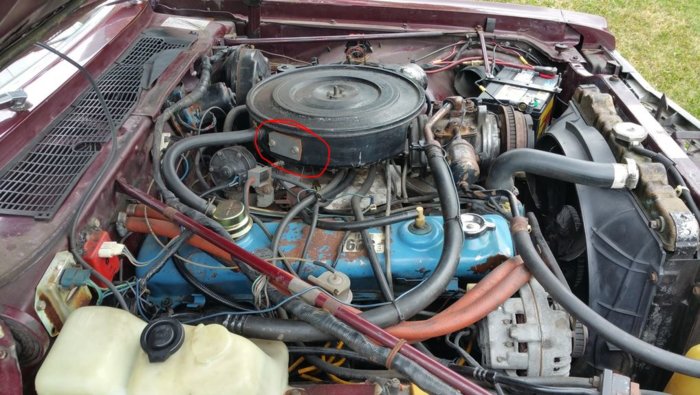 engine bay with plate circled.JPG