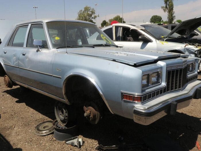 00-1988-dodge-diplomat-in-arizona-wrecking-yard-photograph-by-murilee-martin.jpg