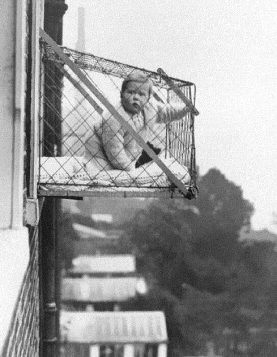 baby-cages-used-to-ensure-that-children-get-enough-sunlight-and-fresh-air-when-living-in-an-ap...jpg