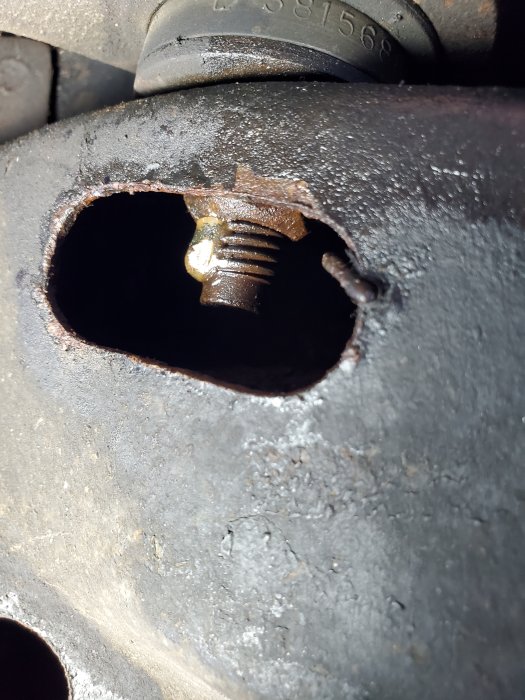 Gran Fury Lower Control Arm Nut Tacked to Bolt With Welding Rod Left Attached.jpg