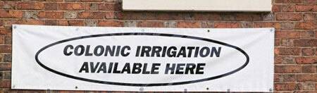 sign-on-a-clinic-in-carlisle-cumbria-uk-offering-colonic-irrigation-aydbyf-1.jpg